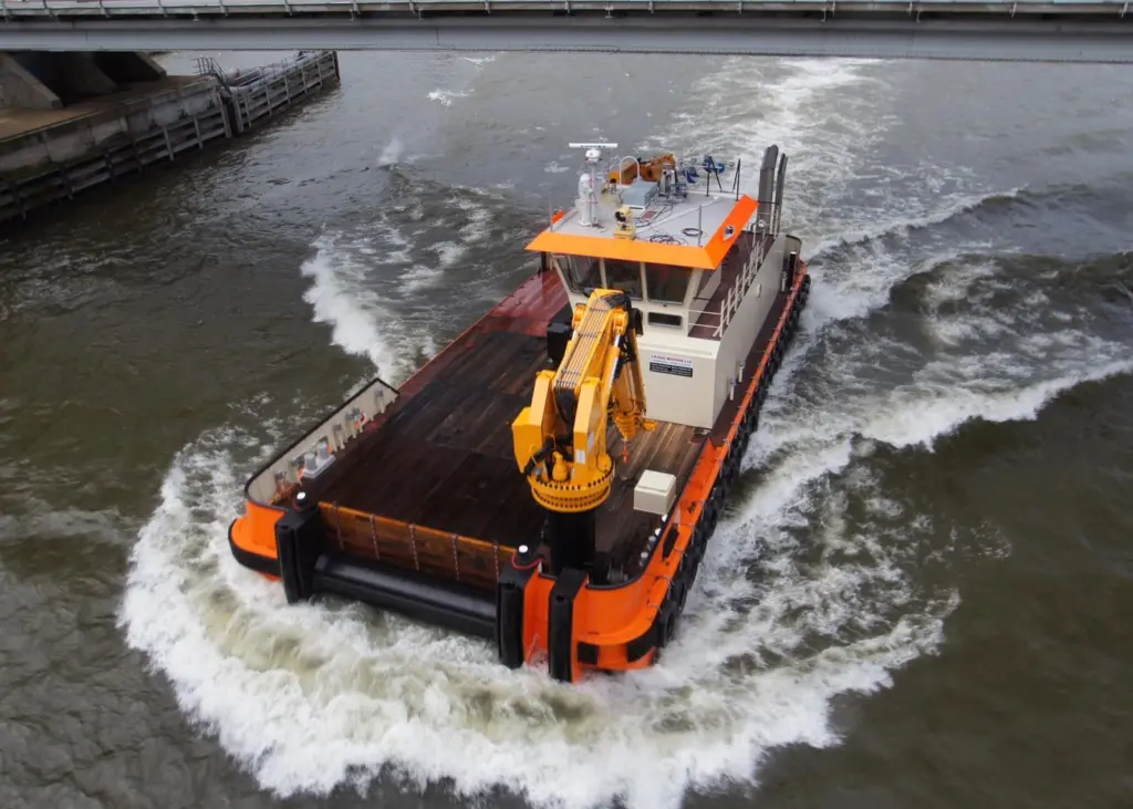 Powerful cranes and ample deck space make for a versatile workboat.