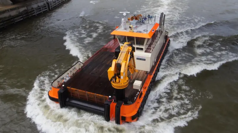 Powerful cranes and ample deck space make for a versatile workboat.