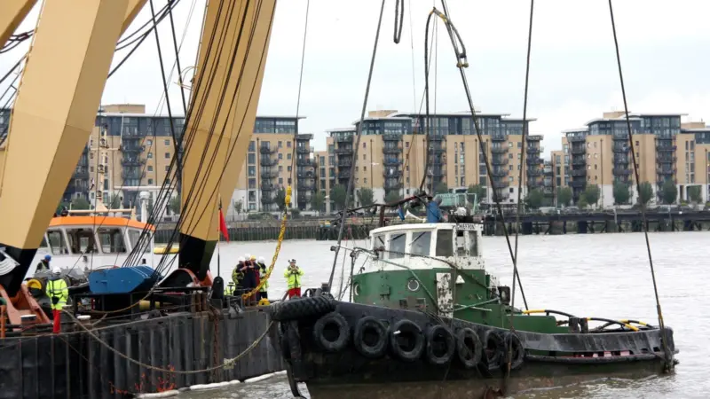 The ill fated Chiefton is cradled in the slings of the floating sheerlegs GPS Apollo shortly after the parbuckling operation to bring it upright.