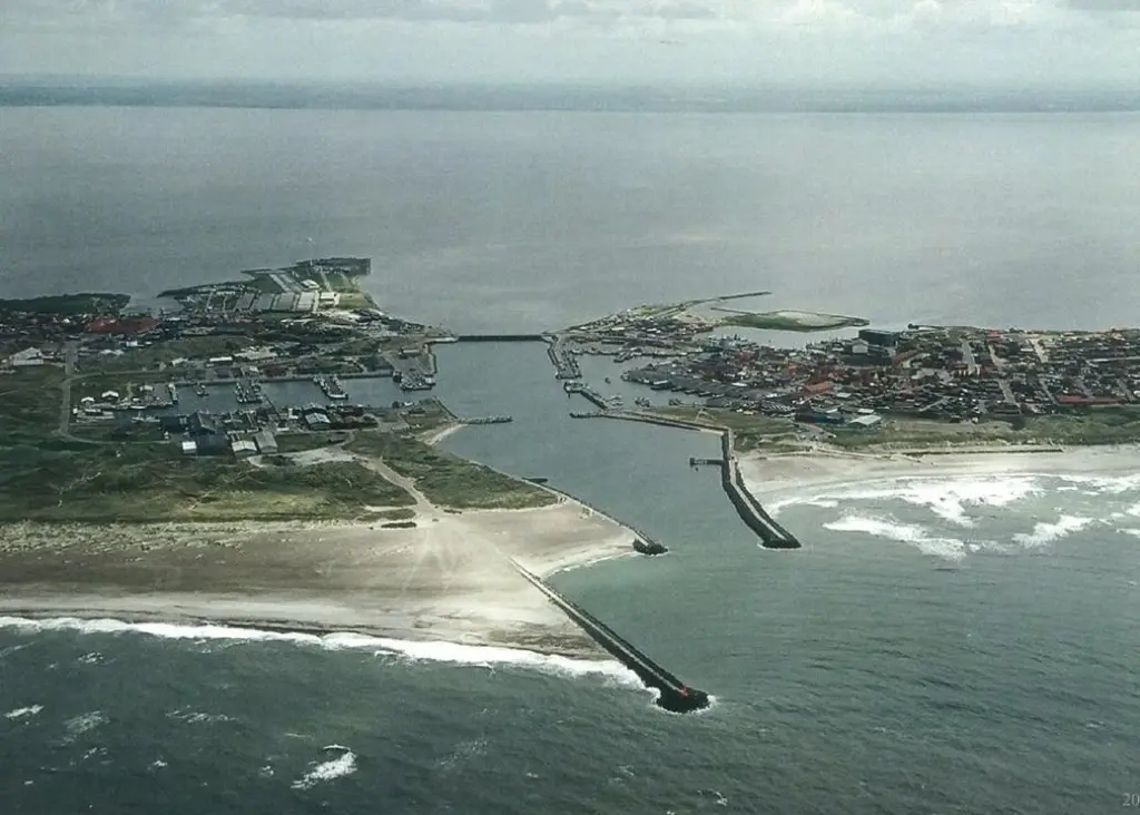An aerial view of Hvide Sande Harbour with the current harbour design.