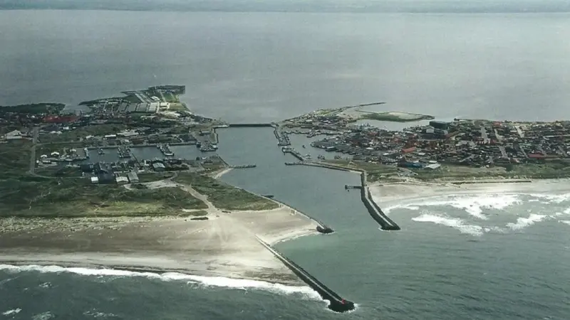 An aerial view of Hvide Sande Harbour with the current harbour design.