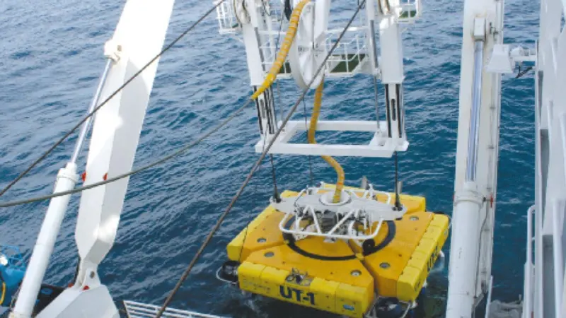 The powerful UT-1 being lowered into position from the Volantis.