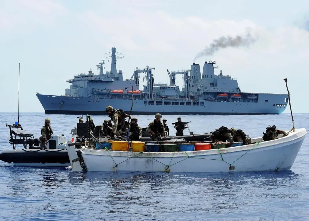 Fleeing pirates stopped and were apprehended after a Lynx helicopter fired warning shots.