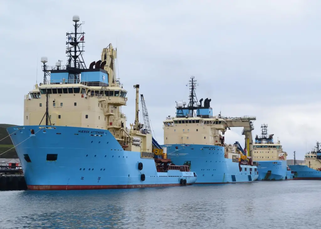 Offshore oil and gas industry vessels crowd Lerwick Harbour in Shetland.