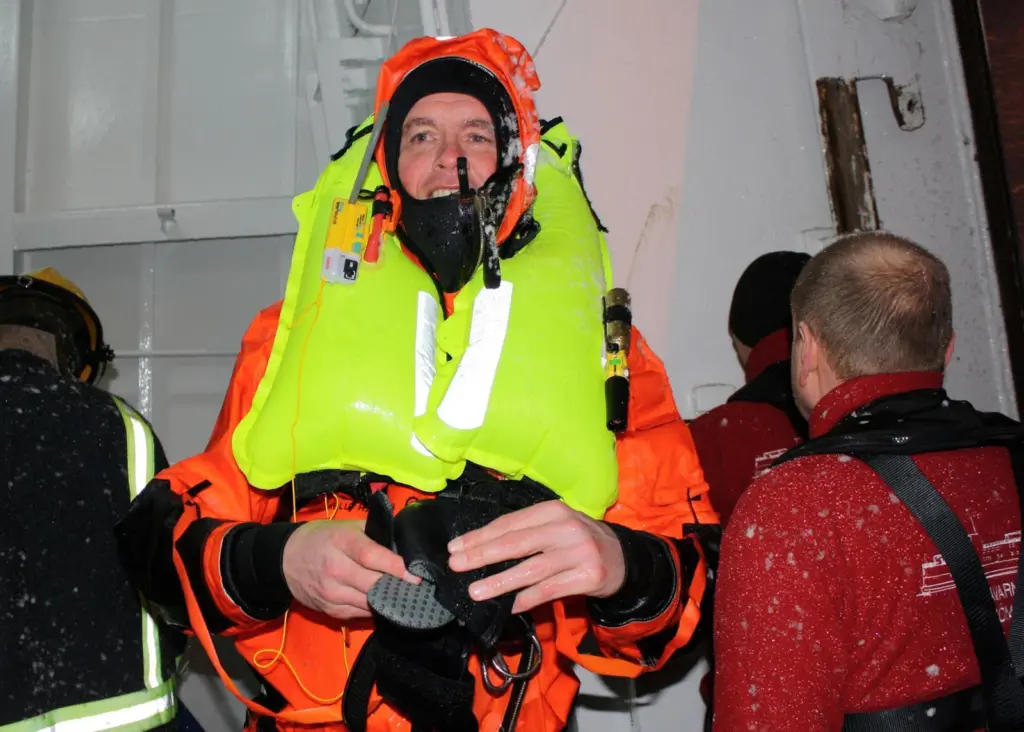 Gudmunder Bragason of Sónar emerges from Rejkavik harbour covered in ice after the successful Kru lifejacket/ R10 demonstration.