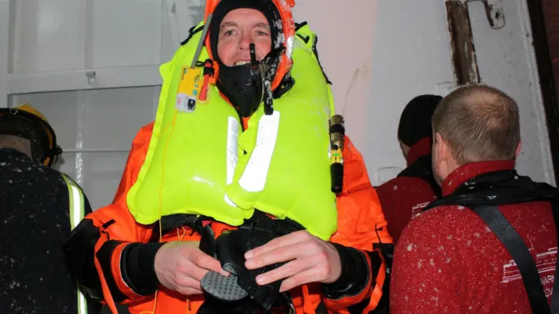 Gudmunder Bragason of Sónar emerges from Rejkavik harbour covered in ice after the successful Kru lifejacket/ R10 demonstration.
