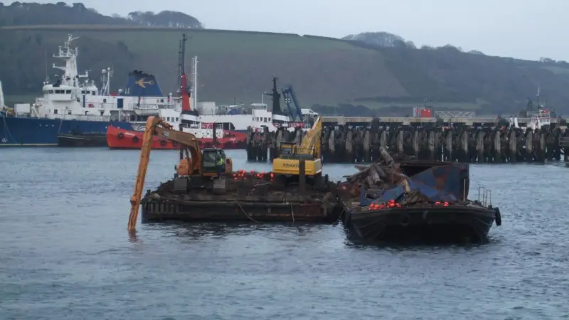 A surveillance photograph presented as evidence, showing the work being carried out at Kings Wharf, Falmouth in December 2007.