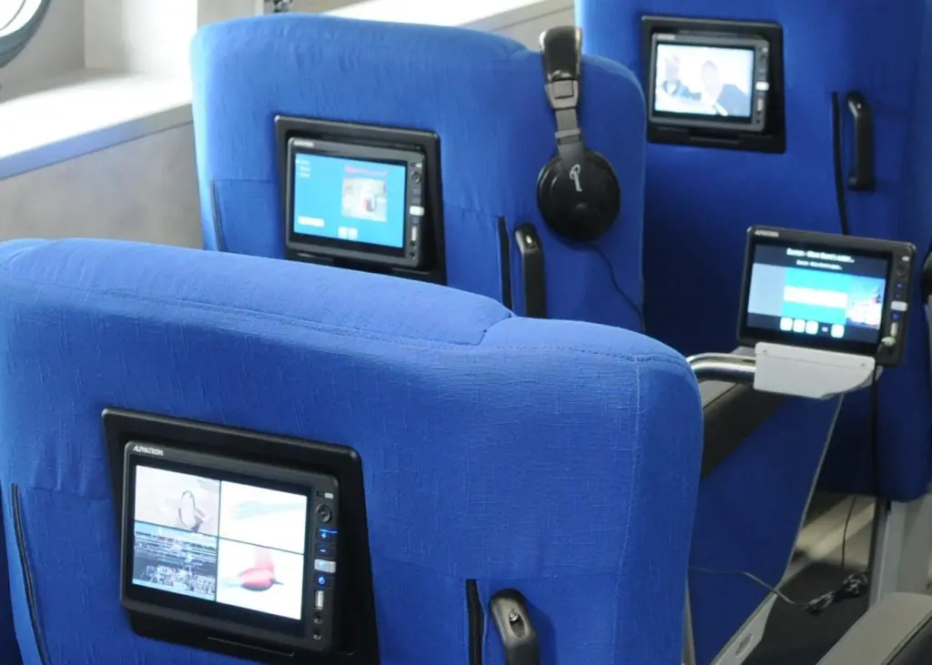 A central server distributes on demand multimedia, such as movies, music and infotainment directly to touch panels for each passenger seat.
