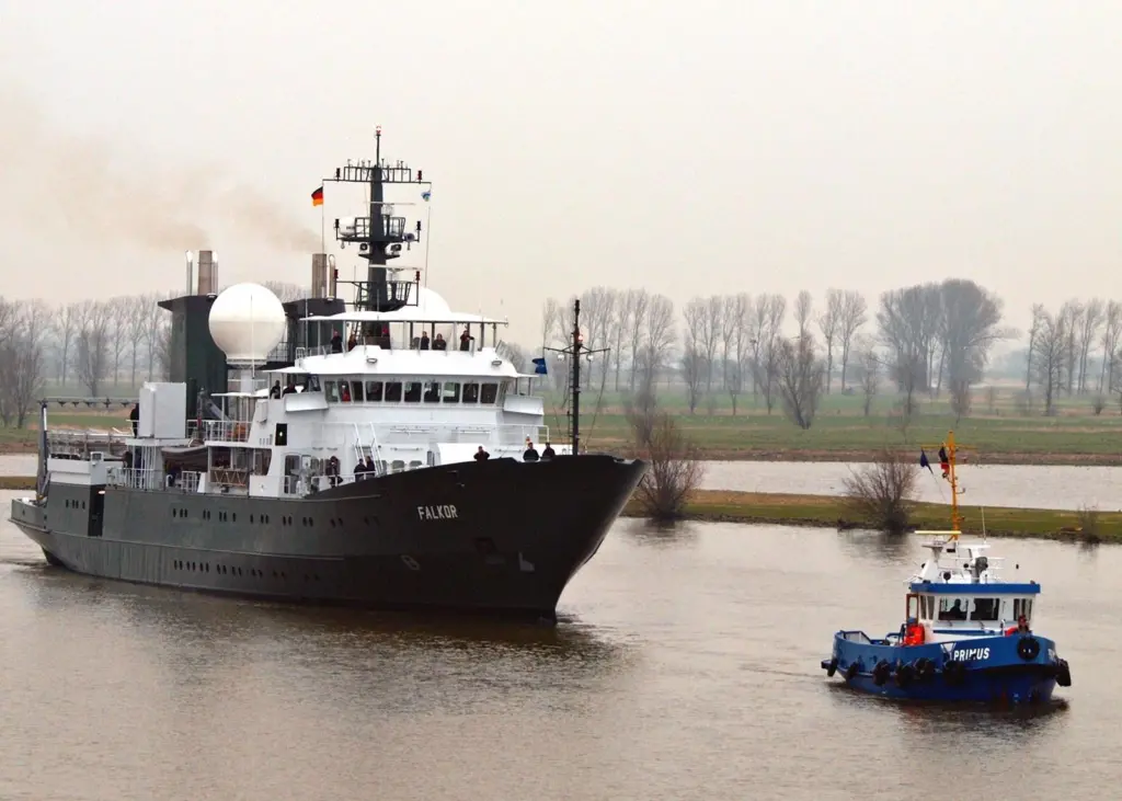 Falkor is escorted from Germany’s Peters Shipyard for sea trials.