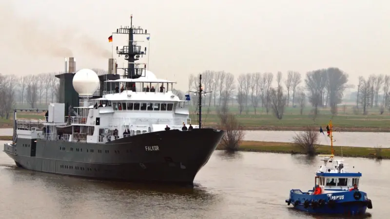 Falkor is escorted from Germany’s Peters Shipyard for sea trials.