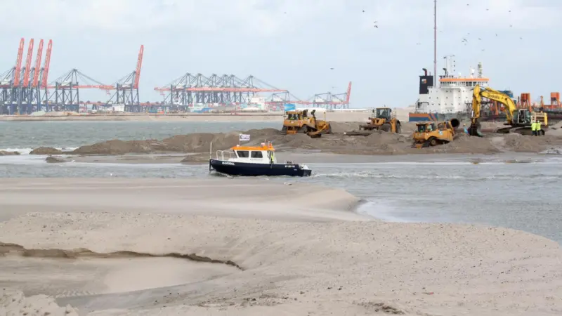 A dam will reduce the mass of water in the port when the seawall gap is filled. Photo: PRA