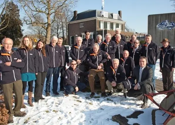 Dutch National Museum of Dredging volunteers show off their new fleeces.