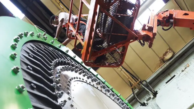 A technician at work on an NGenTec 1MW prototype