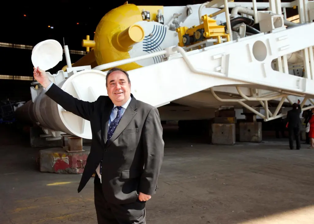 Alex Salmond MSP, the First Minister of Scotland, is seen with Edinburgh based Aquamarine Power’s Oyster 800 hydro-electric wave energy converter.