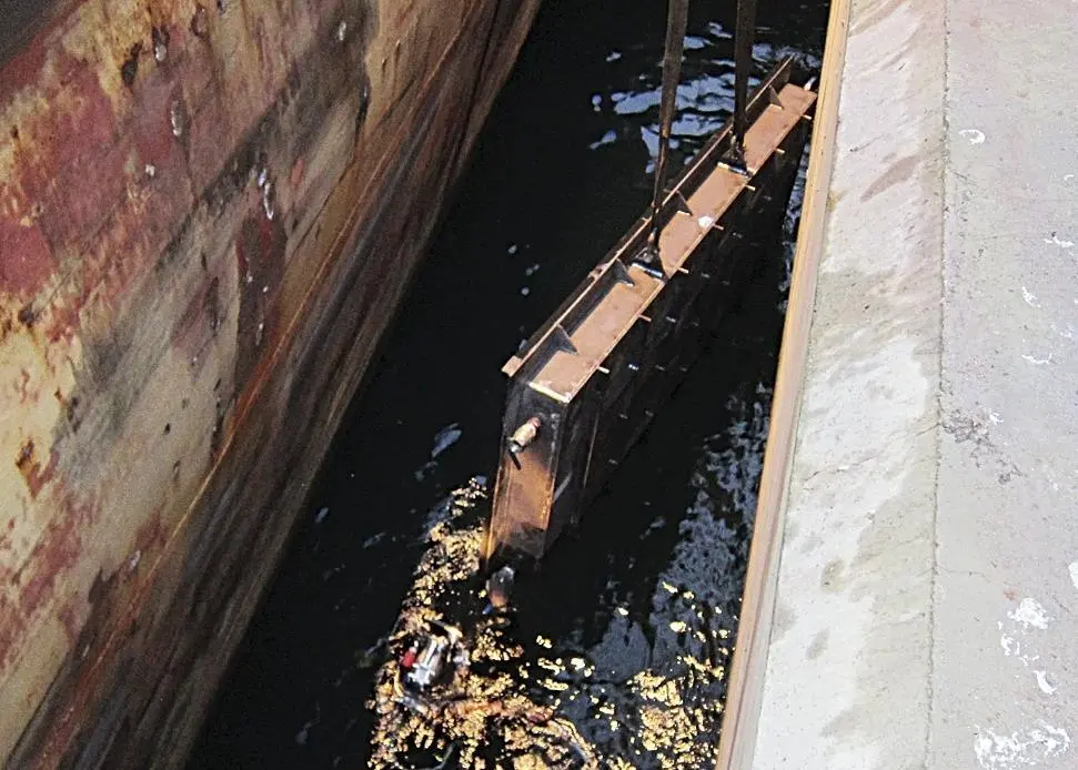 The cofferdam lowered into the water in Spain