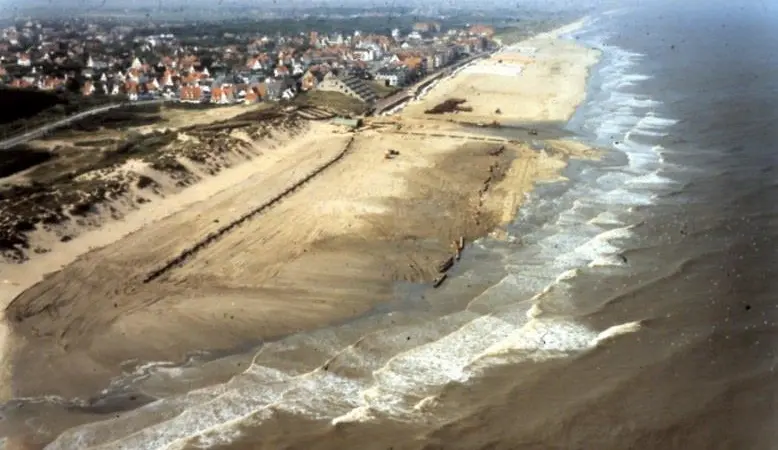 An innovative approach to coastal restoration combining profile nourishments with submerged feeder berm nourishments on the Belgian coast