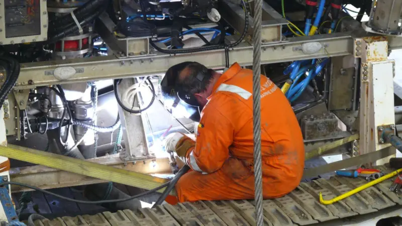 AJ Woods’ personnel carrying out emergency repairs to an ROV that had been damaged on the seabed at the Greater Gabbard Wind Farm project