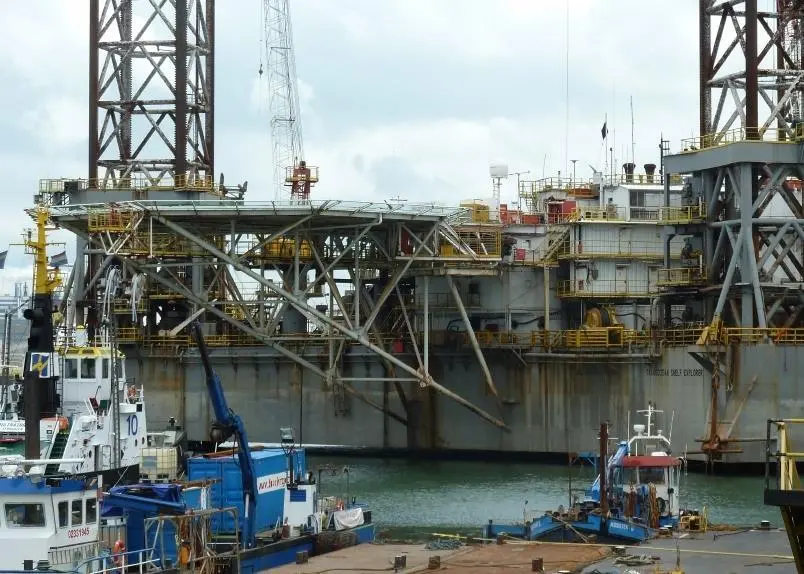 Demolition work started with removing the derricks and drilling installation