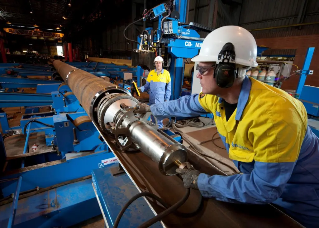 Tata worker Paul Thomson accurately positions a clamp to secure tubular sections ready for welding