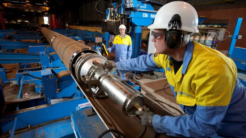 Tata worker Paul Thomson accurately positions a clamp to secure tubular sections ready for welding