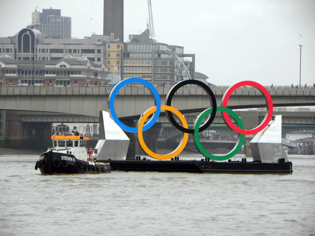 Livett’s tug Steven B is seen manoeuvring the Olympic Rings on the River Thames