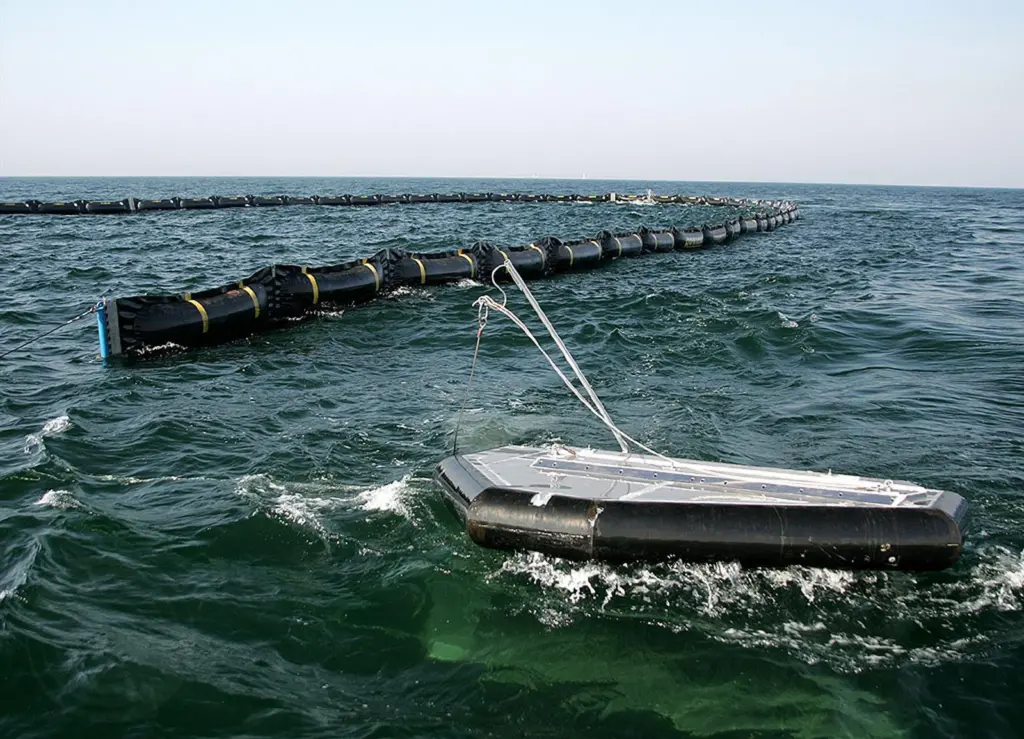 Ocean BoomVane tows a rubber oil containment boom in open water