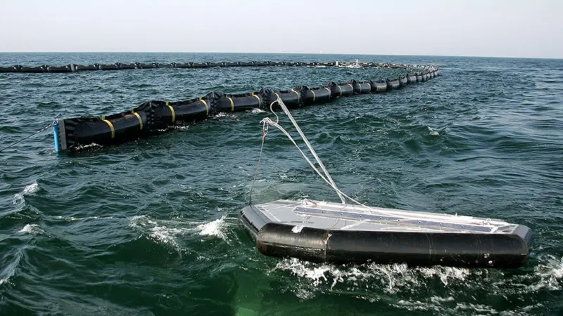Ocean BoomVane tows a rubber oil containment boom in open water