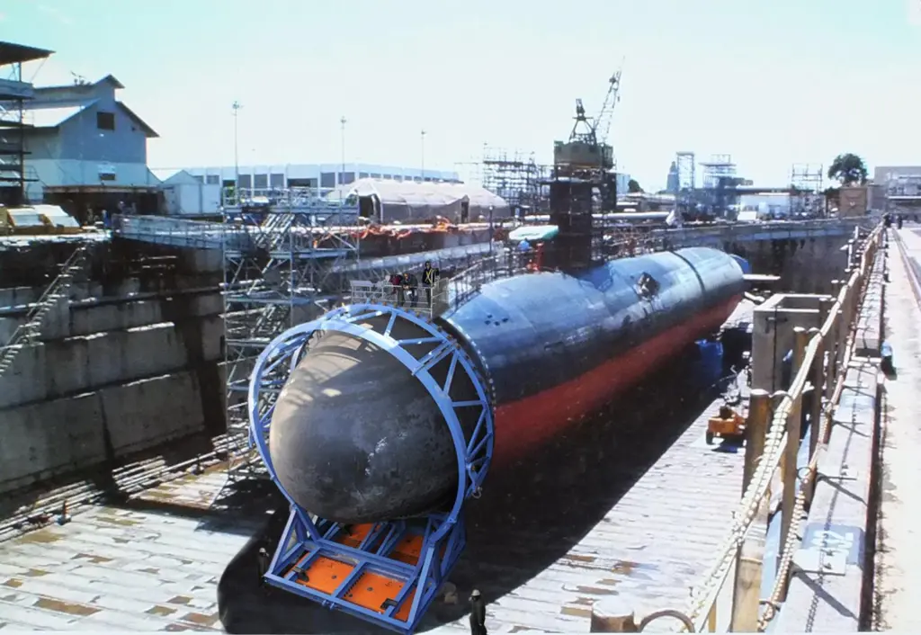Installing the bow dome on a submarine in drydock