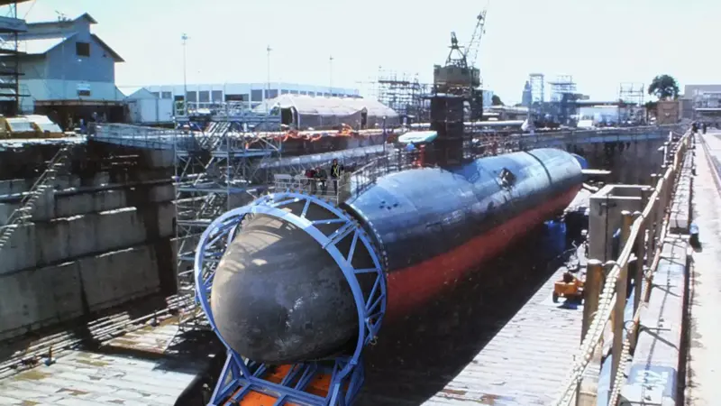 Installing the bow dome on a submarine in drydock