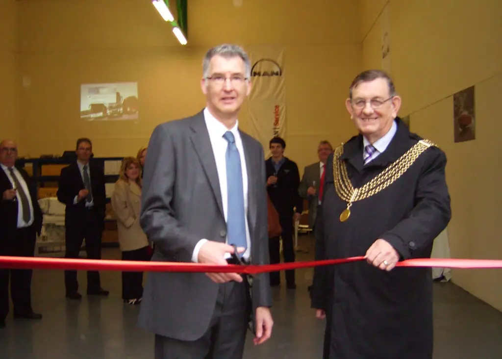 Andrew Mellard, general manager, MAN UK cut the ribbon in the presence of the Lord Mayor, Cllr Michael Wright