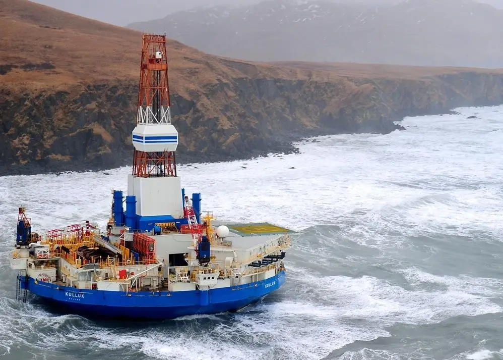 The Arctic exploration rig Kulluk was driven aground in heavy weather off Alaska. Photo courtesy US Coastguard