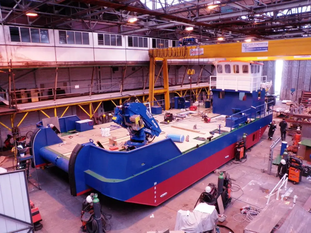 The wheelhouse was lifted up a deck and a mess room/accommodation block constructed beneath it on the main deck