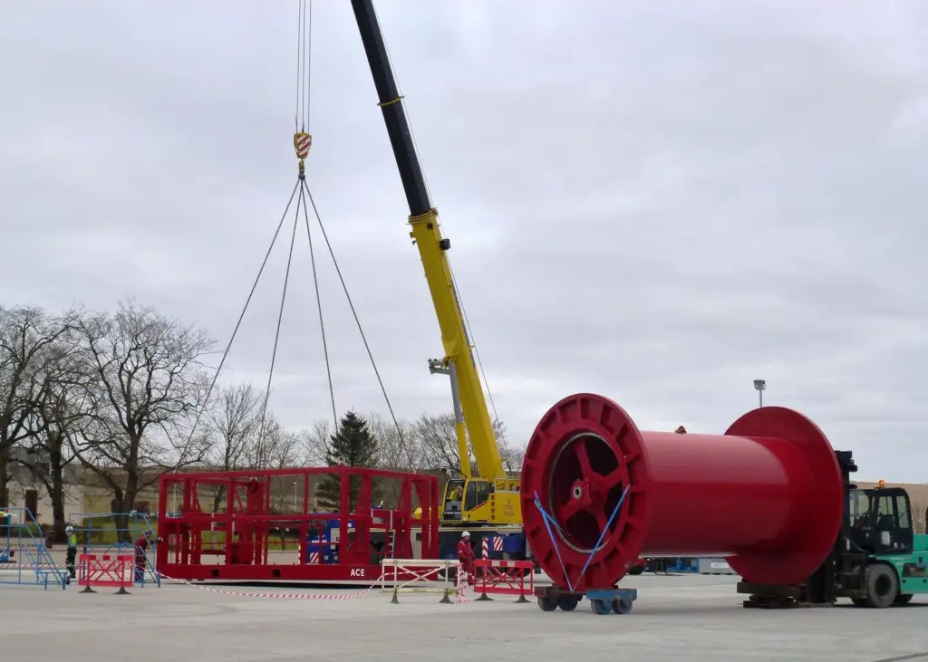 The drum of the large winch being loaded into the crash frame prior to fixing in Ace’s assembly workshop