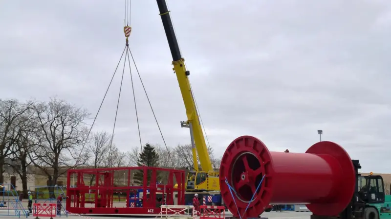 The drum of the large winch being loaded into the crash frame prior to fixing in Ace’s assembly workshop