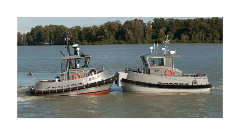 The prototype BRAtt (left) tries out the push knees on the new Suncor V a steel BRAtt 880–SU