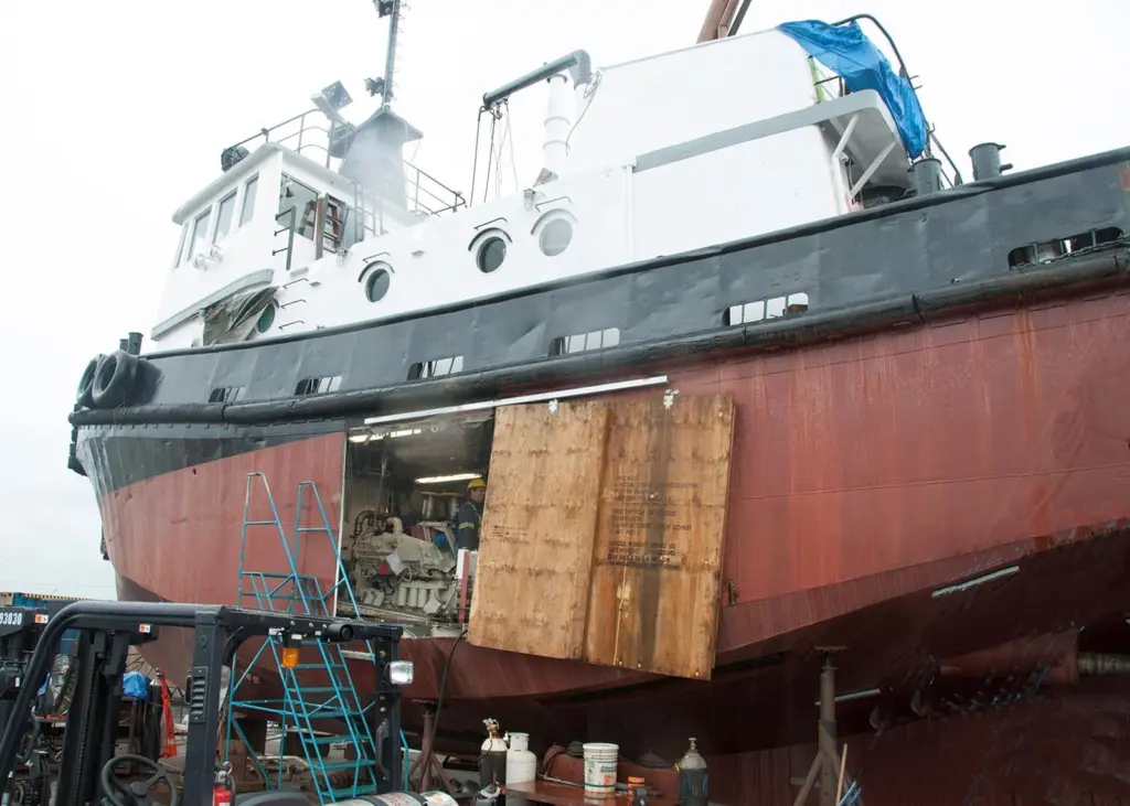 Installing the new engines through the side of the hull rather than lowering them in from above and moving them forward saved money and effort
