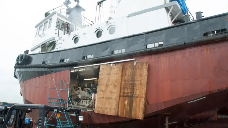 Installing the new engines through the side of the hull rather than lowering them in from above and moving them forward saved money and effort