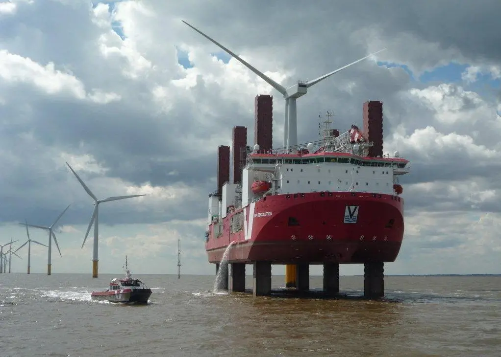 An MPI windfarm service vessel manoeuvres close to a jack-up wind turbine installation ship