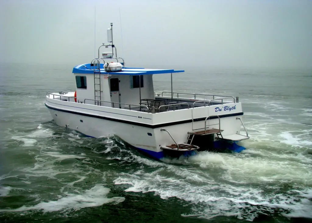 The Dive Blyth Workcat design features a high performance air tunnel hull that enables it to transit to the dive site quickly and economically