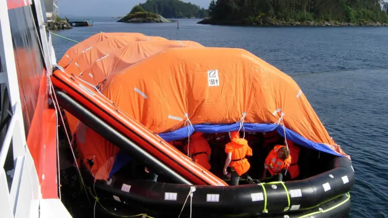 Following the launch of the liferafts, mini escape slides are then deployed to create immediate access to them