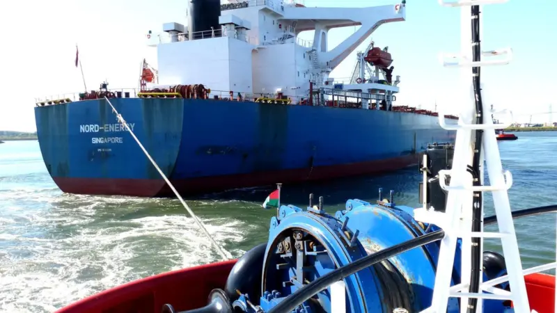 RT Adriaan is seen assisting the bulk carrier Nord-Energy using its forward towing winch