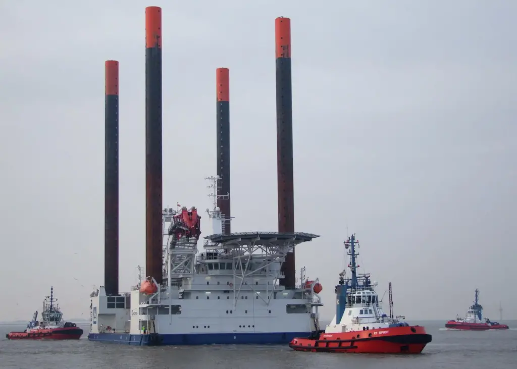 A Kotug Rotor tug is seen working a jack-up