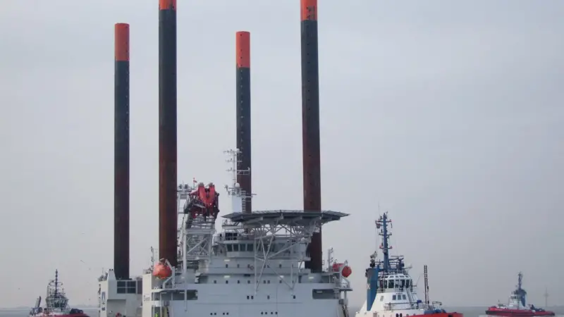 A Kotug Rotor tug is seen working a jack-up
