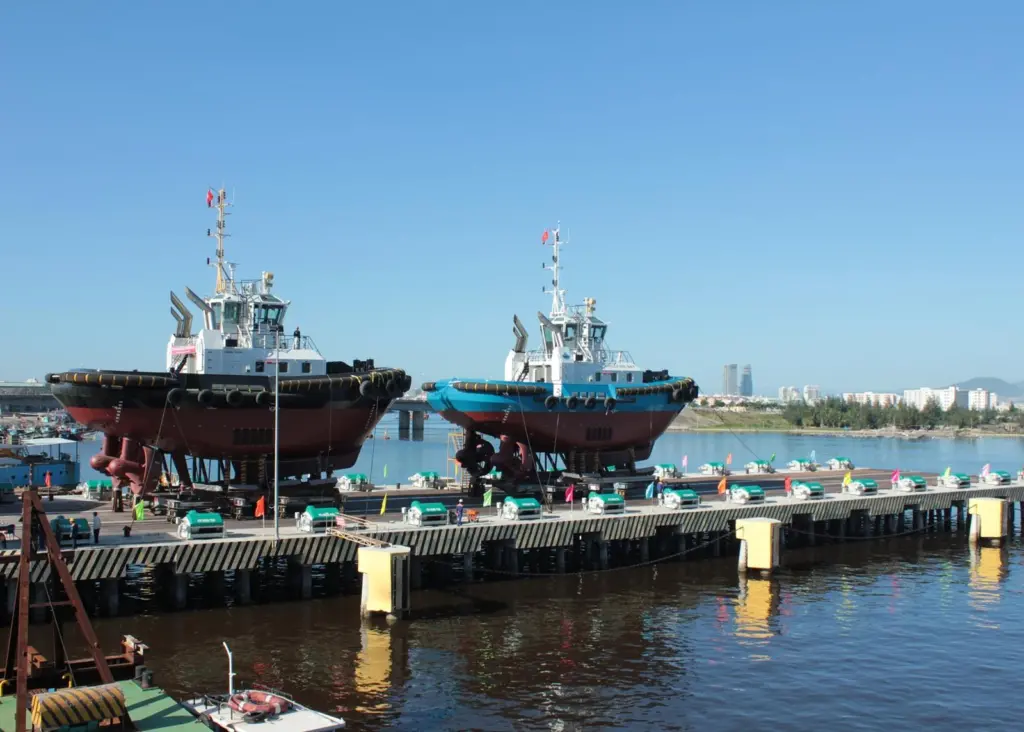 Tugs are seen being launched using the new Syncrolift
