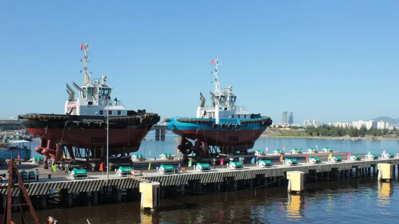 Tugs are seen being launched using the new Syncrolift