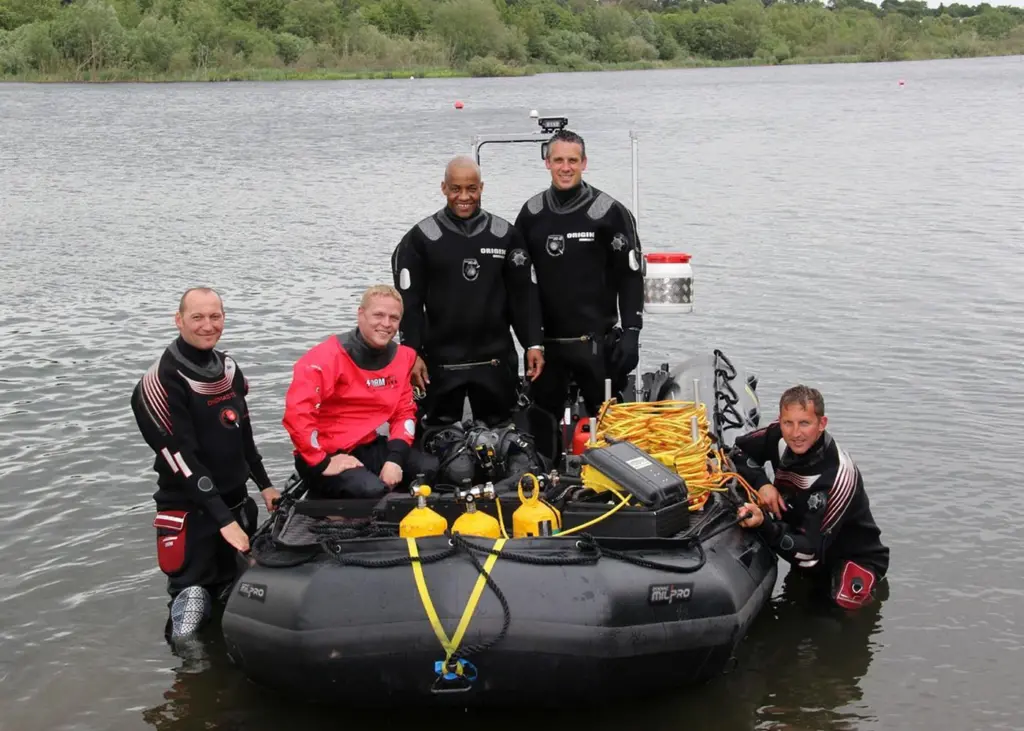 Alan Nicholls (in boat standing left) with members of the Norfolk USWAR team