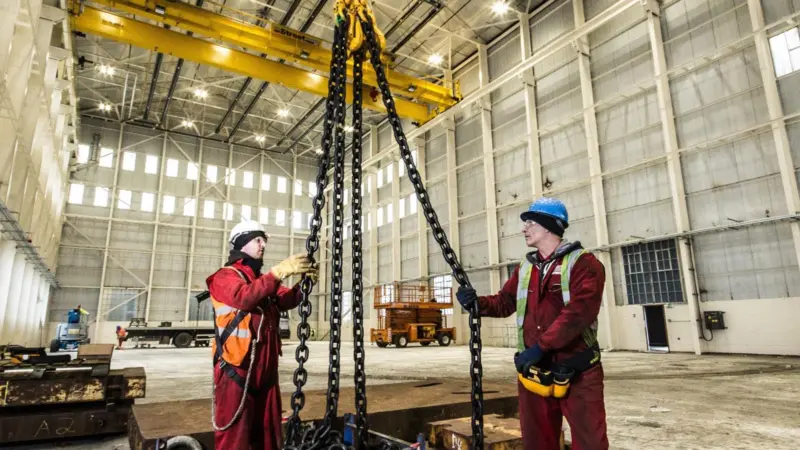 Test weights are deployed during rigorous crane testing before handover to Babcock