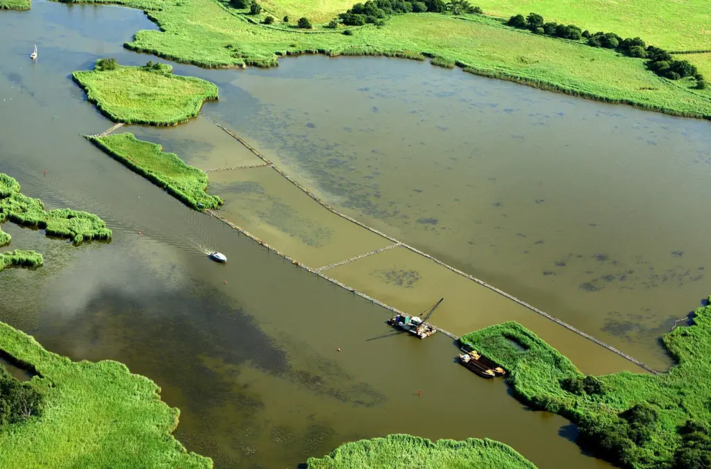 A silt curtain will prevent the spread of sediment during the filling process (Mike Page)