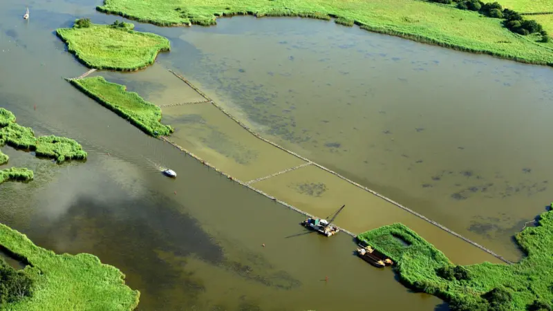 A silt curtain will prevent the spread of sediment during the filling process (Mike Page)