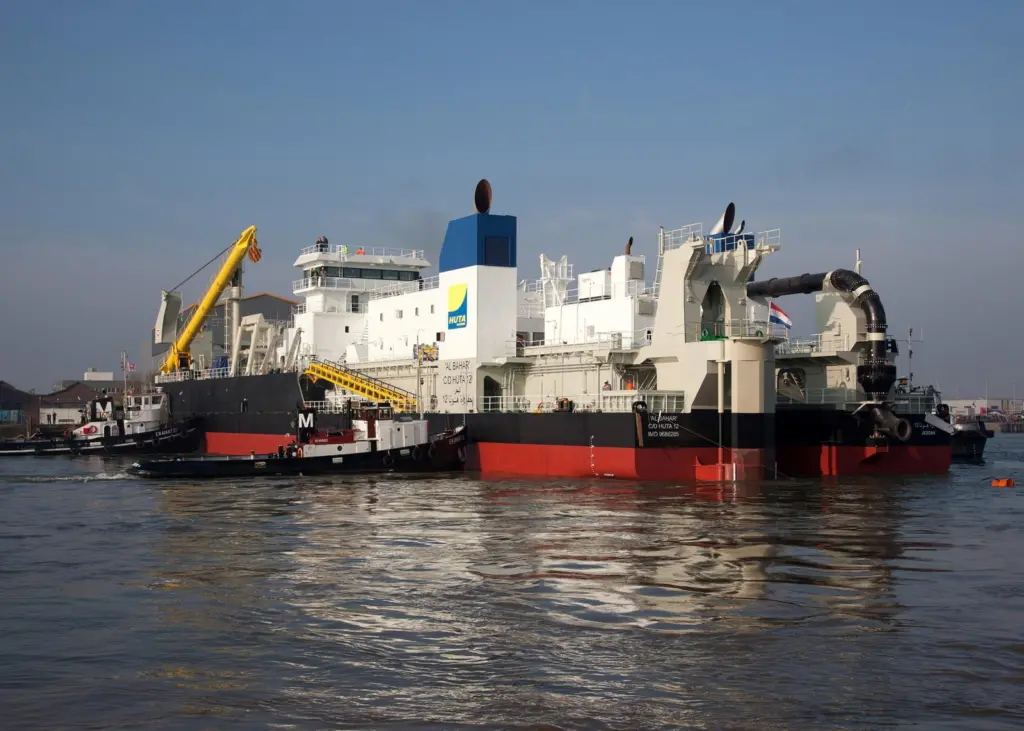 Support vessels take control of the newbuild following its launch at Kinderdijk